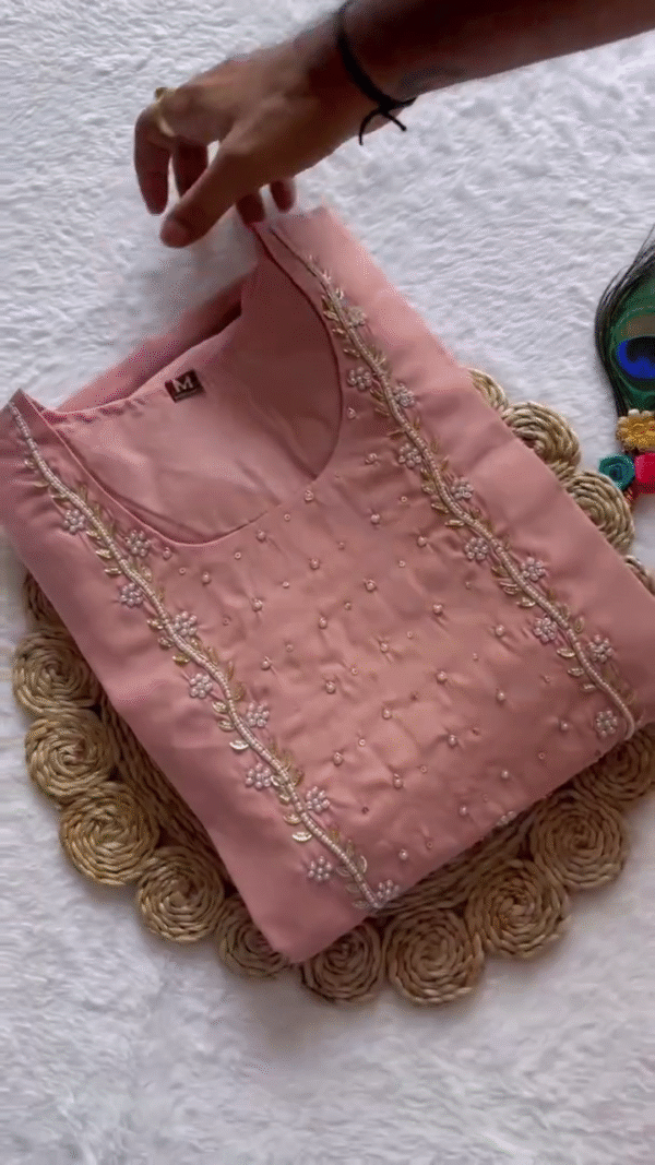Soft Peach Satin Kurta Set – Delicately Embroidered Square Neck Design with Subtle Pearl Accents, Paired with Matching Trousers and Multicolor Abstract Printed Dupatta – Ideal for Elegant Daywear or Casual Festive Looks