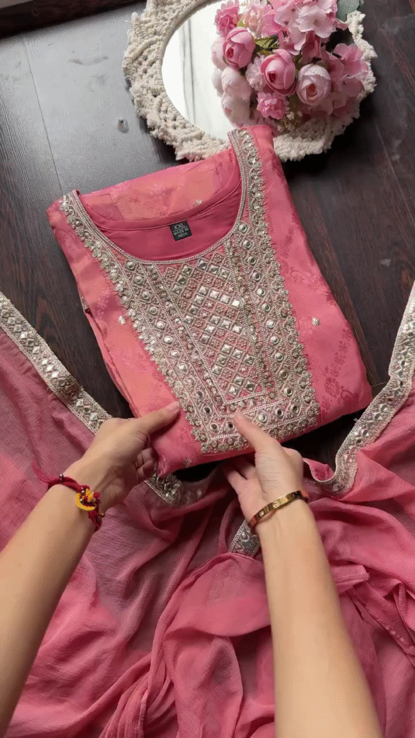 Rose Pink Silk Straight Suit Set Featuring Intricate Mirror and Thread Embroidered Yoke, Subtle Floral Motifs on Kurta, Embellished Sleeve Cuffs, and Matching Flowing Bottom – Perfect for Festive and Ethnic Occasions