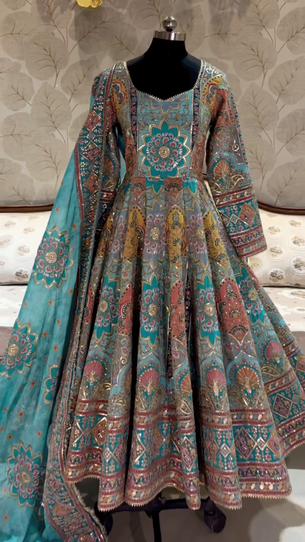 Multicolor Hand-Embroidered Anarkali Gown with Traditional Floral and Geometric Motifs, Full-Length Flared Design, and Matching Embellished Dupatta – Perfect for Weddings, Festive Occasions, and Cultural Celebrations