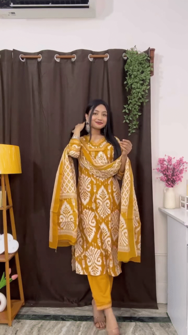 Dual Suit Set Collection Featuring Mustard Yellow Ikat Print Cotton Straight Kurta with Matching Dupatta and Bottom, Paired with Soft White and Pink Floral Printed Anarkali Suit Adorned with Detailed Rose Motifs, Contrasting Printed Dupatta, and Subtle Embellishments – Perfect Blend of Traditional Charm and Everyday Comfort