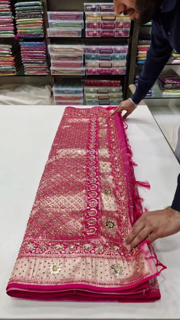 Designer Soft Net Pink Saree with Heavy Mirror Work, Intricate Embroidery, Stone Detailing, and Embellished Floral Borders with Tassel Pallu – Ideal for Wedding and Festive Occasions