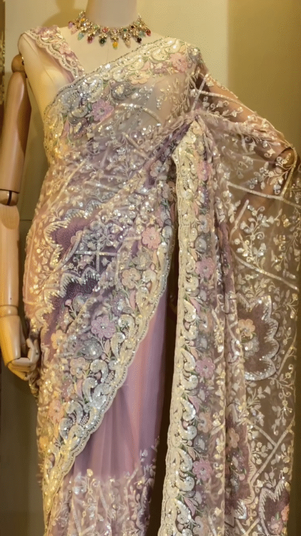 Designer Pastel Pink and Lavender Net Saree with Heavy Floral Embroidery, Sequin and Stone Work, Intricate Cutwork Border, and Sheer Elegant Finish Perfect for Parties, Weddings, and Special Occasions