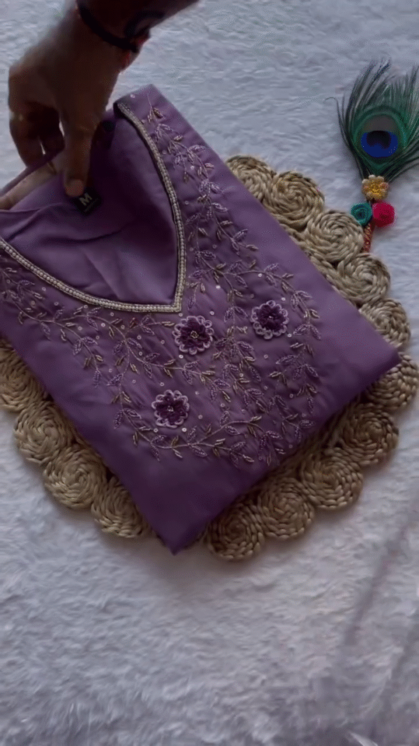 Elegant Lavender Satin Kurta Set – V-Neck with Detailed Floral Thread Embroidery and Sequins, Paired with Matching Elastic-Waist Trousers and a Sheer Purple Floral-Printed Dupatta – Perfect for Graceful Festive or Semi-Formal Wear