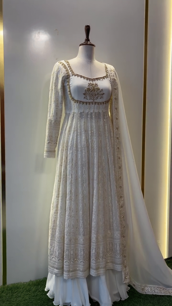 Off-White Georgette Anarkali Suit with Intricate Golden Embroidery, Sequins Detailing, Flared Hem, Square Neckline, Full Sleeves, and Matching Embellished Dupatta – Perfect for Festive and Wedding Occasions