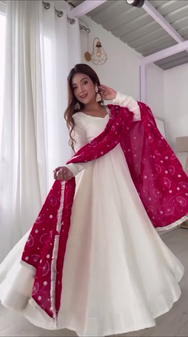 Off-White Flared Anarkali Gown with V-Neckline and Full Sleeves Paired with Contrasting Red Bandhani Printed Dupatta Featuring Mirror Work Detailing – Ideal for Festive Celebrations, Traditional Events, and Ethnic Occasions
