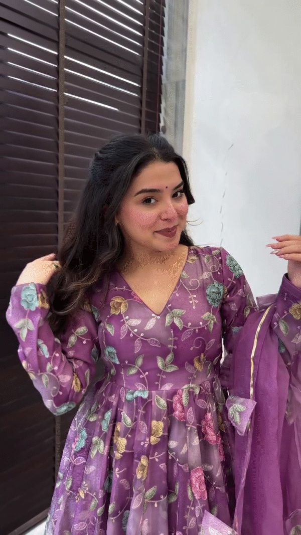 Purple Floral Anarkali Suit Set Featuring V-Neck and Sheer Full Sleeves with Intricate Multicolor Bloom Print, Paired with Matching Flowing Palazzo Pants and a Soft Organza Dupatta Embellished with Floral Tassels and Subtle Golden Border – A Graceful Ethnic Ensemble for Festive and Special Occasions - Image 2