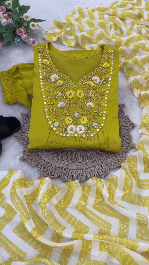 Vibrant Yellow Cotton Anarkali Kurta Set with Intricate Floral Embroidery and Mirror Work on the Neckline, Paired with Matching Bottoms and Chevron Printed Dupatta – Perfect for Haldi, Daytime Festivities, and Traditional Celebrations