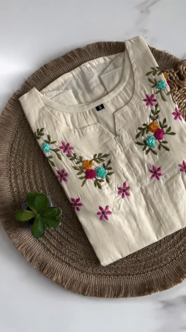 Elegant Cream Embroidered Kurti with Colorful Floral Detailing – Perfect for Casual and Festive Occasions, Offering a Fresh and Vibrant Look.