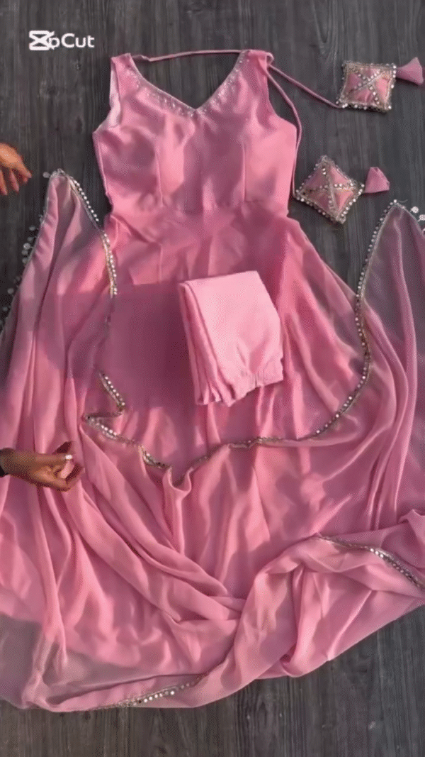 A gorgeous pink dress with delicate beaded detailing along the edges, accompanied by a matching dupatta and pants. - Image 2