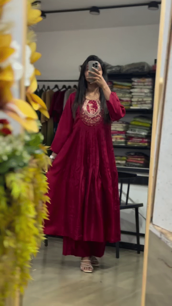 Elegant Red Embroidered Long Dress with Detailed Neckline and Flowing Silhouette