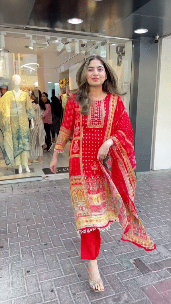 Vibrant Red Straight-Cut Suit Featuring Traditional Bandhani-Inspired Print and Intricate Embroidered Panels – Accented with a Printed Dupatta and Tassel Detailing – Ideal for Festive Events and Traditional Celebrations