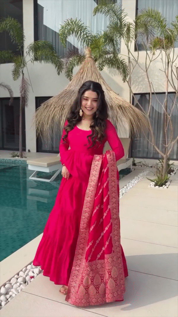Radiating Joy in a Vibrant Red Flowing Dress, Twirling Gracefully by the Poolside with a Matching Red Dupatta and Trendy Sunglasses, Exuding a Fun and Chic Vibe - Image 2
