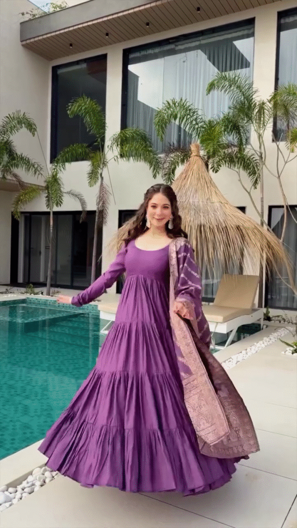 Twirl in Style: Wearing a Beautiful Purple Tiered Dress with a Complementary Printed Dupatta, Capturing Grace and Elegance by the Poolside in a Modern, Serene Setting