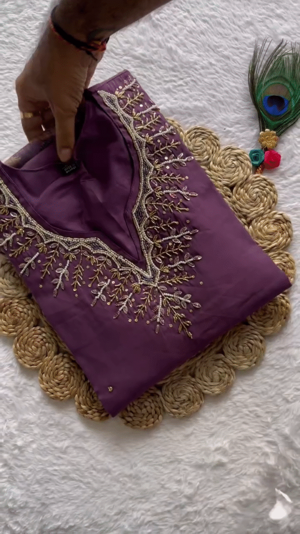 Plum Purple Straight Kurta Set with Intricate Golden Threadwork Neckline – Paired with a Lightweight Organza Dupatta Adorned in Bold Floral Motifs – Perfect for Elegant Gatherings & Effortless Everyday Grace.