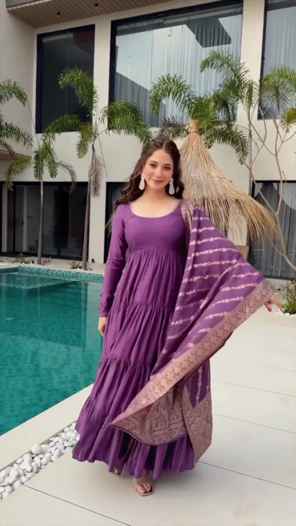 Twirl in Style: Wearing a Beautiful Purple Tiered Dress with a Complementary Printed Dupatta, Capturing Grace and Elegance by the Poolside in a Modern, Serene Setting - Image 2