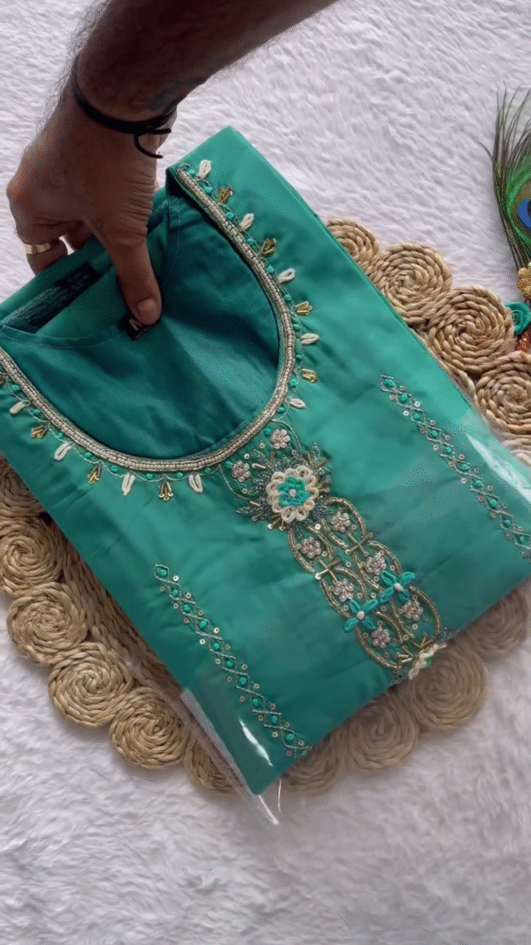 Fresh Aqua Green Straight Kurta Set with Delicate Embroidered Yoke & Mirror Detailing – Paired with a Sheer Organza Dupatta Accented by Leafy Motifs & Subtle Golden Borders – Perfect Blend of Light Festive Flair & Daytime Elegance.