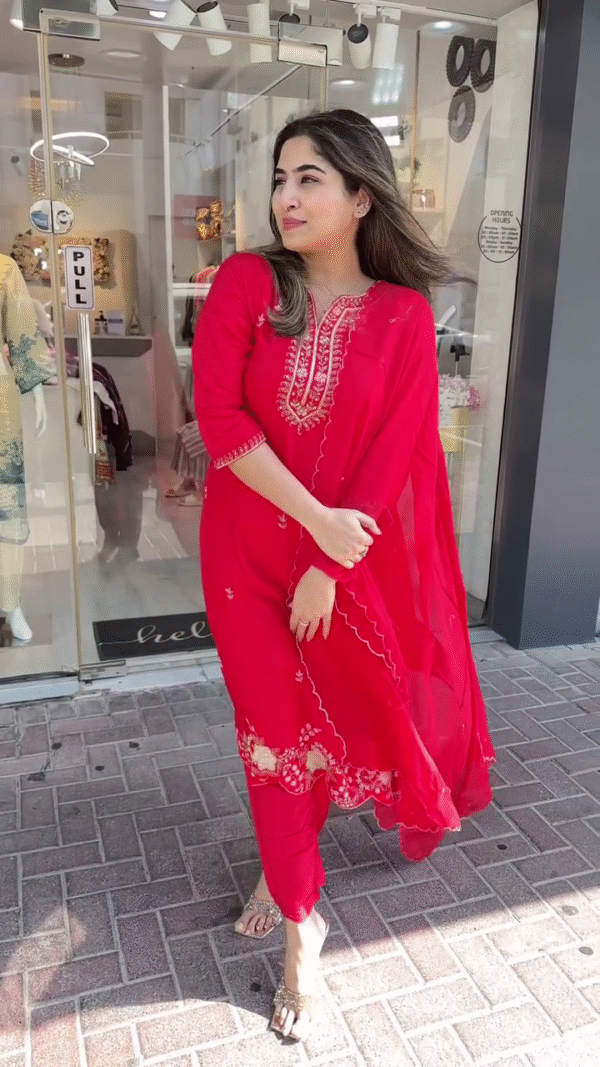Vibrant Red Straight-Cut Suit with Intricate Thread and Sequin Embroidery on Neckline and Hem – Paired with Delicately Embellished Dupatta and Tapered Pants – A Timeless Choice for Festive Occasions and Traditional Events