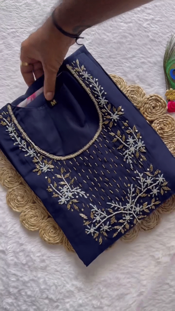 Midnight Blue Kurta Set with Intricate Thread & Sequin Work on the Yoke – Paired with a Flowing Organza Dupatta Featuring Bold Floral Digital Prints & Subtle Golden Accents – A Striking Blend of Festive Glam & Elegant Grace.