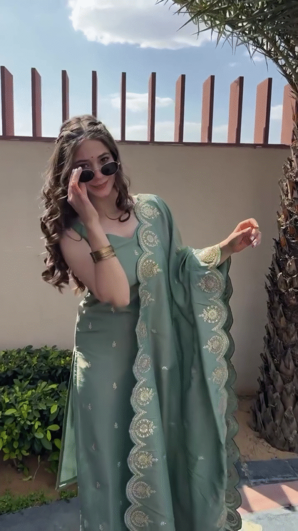 Elegant Sage Green Salwar Kameez with Gold Embroidery, Paired with a Flowing Dupatta for a Chic Look.