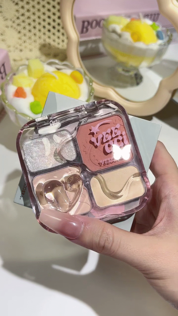 This adorable makeup palette features four shades: a shimmery silver, a soft peachy blush, a light cream base