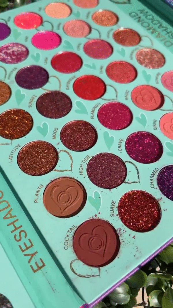 Vibrant Glitter and Matte Eyeshadow Palette with a Stunning Range of Reds, Pinks, Purples, and Browns for Bold and Playful Eye Looks