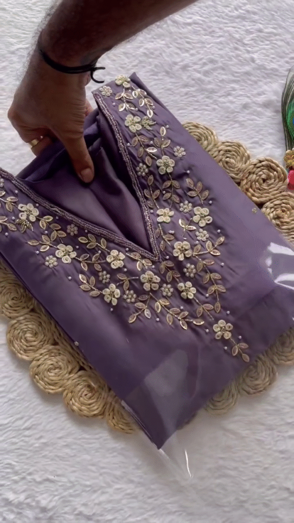 Elegant Lavender Suit Set adorned with delicate floral embroidery on the neckline paired with a soft net dupatta featuring bold butterfly prints and golden accents.