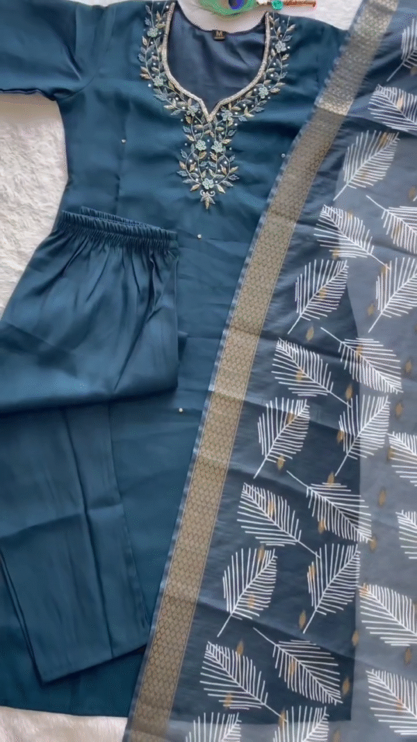 Chic Teal Blue Suit Set featuring intricate floral embroidery around the neckline, complemented by a sheer dupatta with white and gold leaf motifs and a textured golden border — perfect for a graceful and contemporary ethnic look. - Image 2