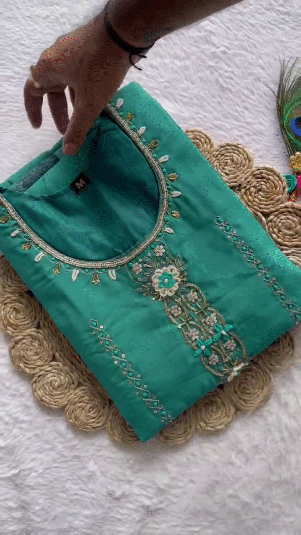 Grace meets freshness in this stunning aqua green suit, adorned with delicate mirror work on the neckline. Paired with a soft, sheer dupatta featuring elegant leaf motifs, it's perfect for festive charm.