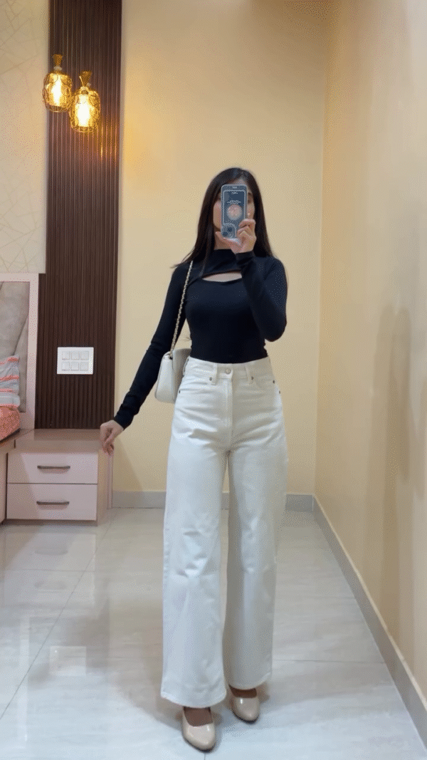 Black sweetheart neckline fitted top paired with high-waisted light blue wide-leg jeans, black strappy sandals, and a black shoulder bag for a sleek everyday look. - Image 2