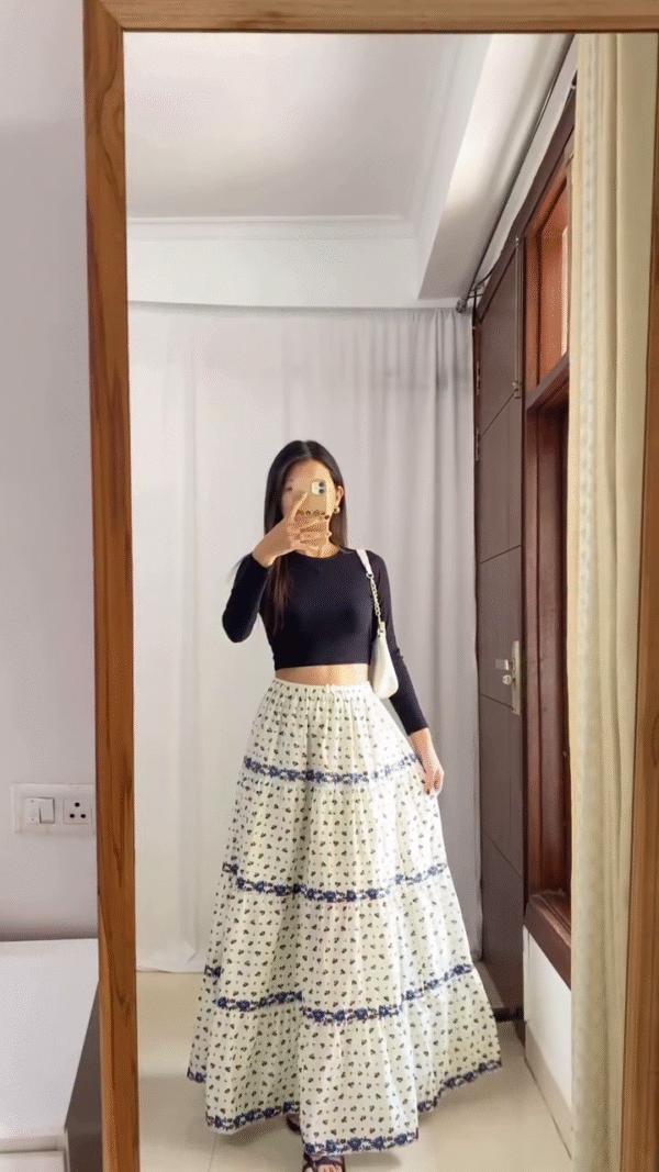 Boho-Chic Maxi Skirt Outfits — Featuring Cream Printed Tiered Skirt with Blue Floral Accents for a Playful Look, and Solid White Tiered Skirt with Drawstring Waist for an Elegant Minimal Style